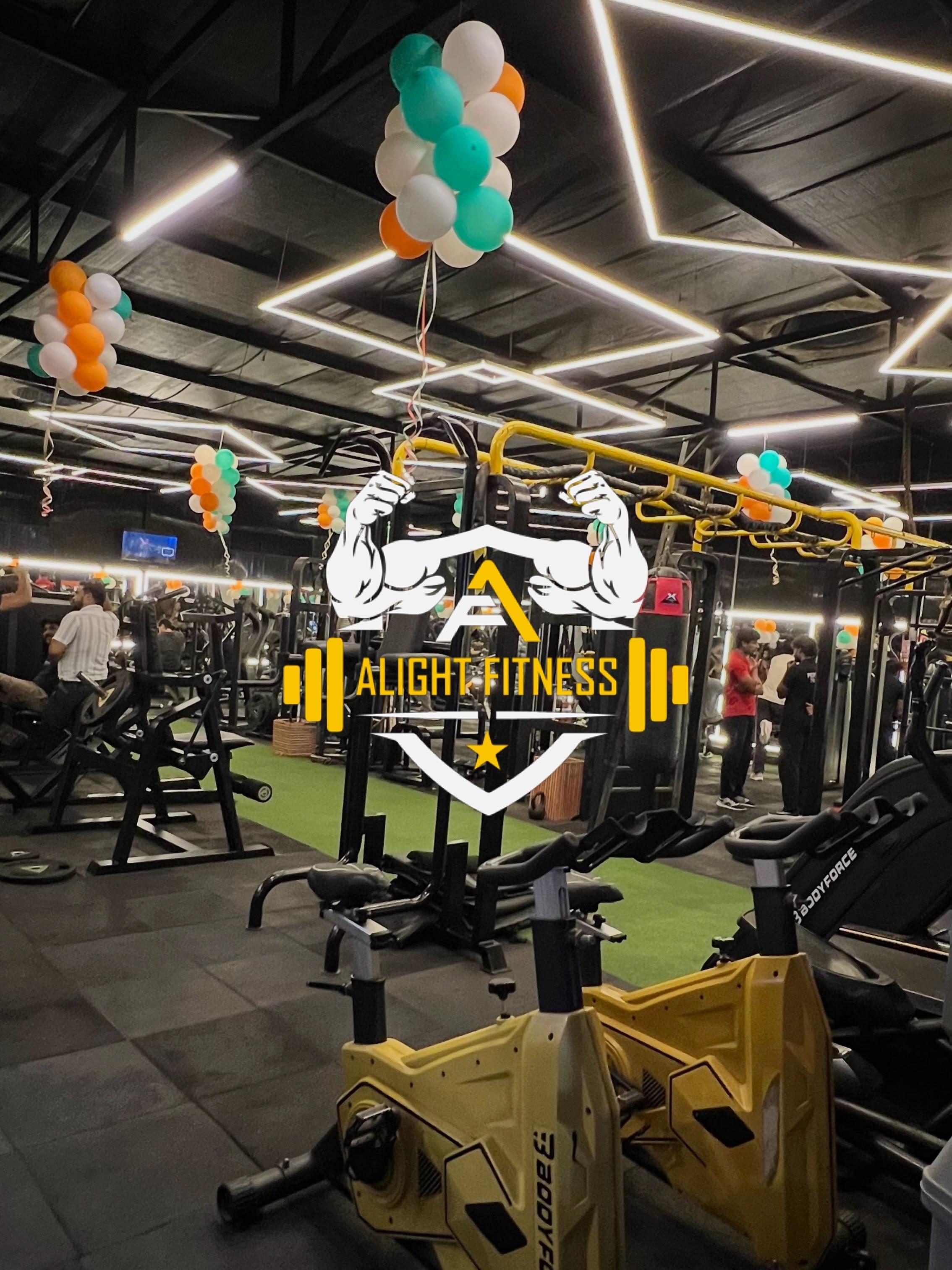 Alight Fitness Gym — equipment floor with cable machines and cardio
